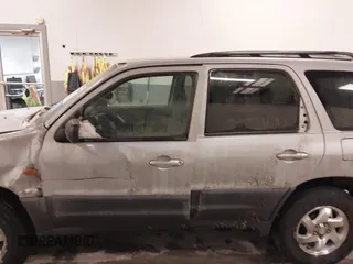 2003 Mazda Tribute DX with VIN 4F2YZ02B73KM43813, listed as a IAAI auction lot 41575708 with 202,214 mi miles and . Bid and sale history available at carsss.com. Image 14.