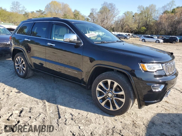 2017 Jeep Grand Cherokee Overland with VIN 1C4RJFCT3HC755960, listed as a Copart auction lot 52268895 with 99,998 mi miles and Salvage title. Bid and sale history available at DreamBid. Image 4.