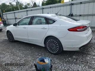 2017 Ford Fusion SE z VIN 3FA6P0H92HR203496, wystawiony jako Copart lot #56719365 z przebiegiem 99 817 mil mil oraz Szkoda całkowita • Salvage title. Historia ofert i sprzedaży dostępna na DreamBid. Obrazek 2.