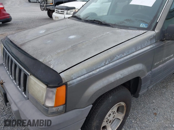 1996 Jeep Grand Cherokee with VIN 1J4EZ58S1TC112995, listed as a IAAI auction lot 41706966 with 356,727 mi miles and . Bid and sale history available at DreamBid. Image 14.