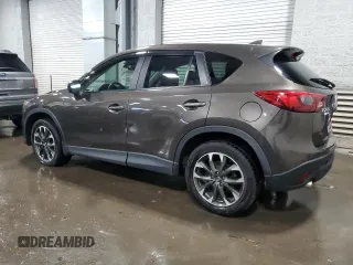 2016 Mazda CX-5 Grand Touring with VIN JM3KE4DY4G0600877, listed as a Copart auction lot 85560194 with 82,395 mi miles and Salvage Title. Bid and sale history available at carsss.com. Image 2.