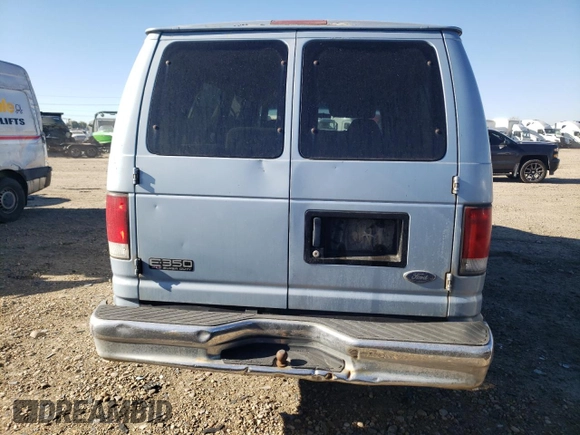 1999 Ford Econoline Passenger XL with VIN 1FBSS31L6XHB60672, listed as a Copart auction lot 79319714 with 295,551 mi miles and Clean Title. Bid and sale history available at DreamBid. Image 6.