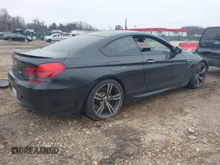 2014 BMW M6 z VIN WBSLX9C58ED160558, wystawiony jako IAAI lot #41553209 z przebiegiem 154 789 mil mil oraz . Historia ofert i sprzedaży dostępna na DreamBid. Obrazek 4.
