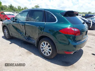 2014 Porsche Cayenne with VIN WP1AA2A21ELA06570, listed as a IAAI auction lot 42473298 with 61,421 mi miles and . Bid and sale history available at DreamBid. Image 3.
