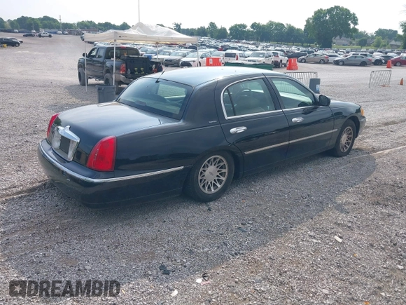2001 Lincoln Town Car Signature with VIN 1LNHM82W11Y613959, listed as a IAAI auction lot 42432229 with 144,660 mi miles and . Bid and sale history available at DreamBid. Image 4.