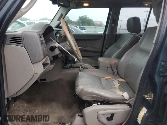2006 Jeep Commander with VIN 1J8HH48NX6C125803, listed as a Copart auction lot 71247304 with 214,297 mi miles and Salvage Title. Bid and sale history available at carsss.com. Image 7.