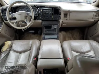 2003 GMC Yukon Denali z VIN 1GKEK63U43J263449, wystawiony jako Copart lot #53848345 z przebiegiem 144 280 mil mil oraz Szkody całkowita. Historia ofert i sprzedaży dostępna na DreamBid. Obrazek 8.