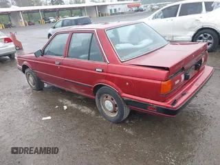 1990 Nissan Sentra z VIN JN1GB21B5LU503902, wystawiony jako IAAI lot #42358723 z przebiegiem 172 484 mil mil oraz . Historia ofert i sprzedaży dostępna na DreamBid. Obrazek 3.