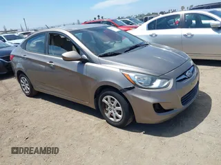 2012 Hyundai Accent GLS with VIN KMHCT4AEXCU261411, listed as a IAAI auction lot 42087696 with 122,184 mi miles. Bid and sale history available at carsss.com. Image 1.