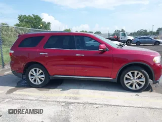 2013 Dodge Durango Crew z VIN 1C4RDJDG6DC672934, wystawiony jako IAAI lot #42542073 z przebiegiem 181 812 mil mil oraz . Historia ofert i sprzedaży dostępna na DreamBid. Obrazek 13.
