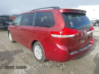 2014 Toyota Sienna XLE with VIN 5TDYK3DCXES471676, listed as a IAAI auction lot 41853038 with 169,790 mi miles. Bid and sale history available at carsss.com. Image 3.