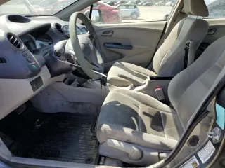 2010 Honda Insight EX with VIN JHMZE2H7XAS021268, listed as a Copart auction lot 54179245 with 211,561 mi miles and Salvage Title. Bid and sale history available at DreamBid. Image 7.