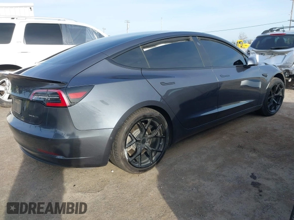2019 Tesla Model 3 Long Range with VIN 5YJ3E1EB6KF413320, listed as a IAAI auction lot 41760428 with 90,441 mi miles and . Bid and sale history available at DreamBid. Image 4.