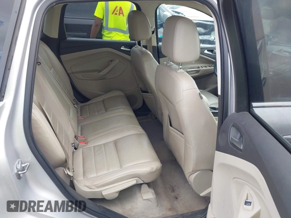 2016 Ford Escape Titanium with VIN 1FMCU9J95GUB93585, listed as a IAAI auction lot 42614106 with 124,465 mi miles and . Bid and sale history available at DreamBid. Image 8.