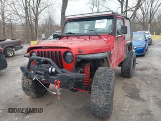 2002 Jeep Wrangler X z VIN 1J4FA39S52P708519, wystawiony jako IAAI lot #41569747 z przebiegiem 219 168 mil mil oraz . Historia ofert i sprzedaży dostępna na DreamBid. Obrazek 17.