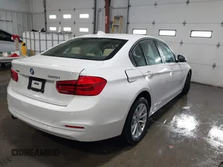 2018 BMW 3 Series 320i xDrive with VIN WBA8E5G56JNU47338, listed as a IAAI auction lot 41238204 with 54,596 mi miles. Bid and sale history available at carsss.com. Image 4.