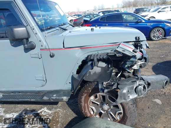 2015 Jeep Wrangler Unlimited Willys Wheeler with VIN 1C4BJWDG4FL589822, listed as a IAAI auction lot 41732614 with 149,112 mi miles and . Bid and sale history available at DreamBid. Image 18.