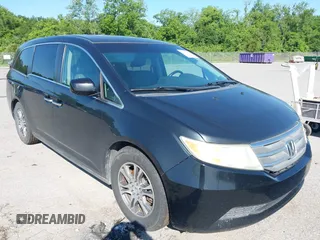 2011 Honda Odyssey EX-L with VIN 5FNRL5H66BB058333, listed as a IAAI auction lot 42172045 with 215,723 mi miles and . Bid and sale history available at carsss.com. Image 1.