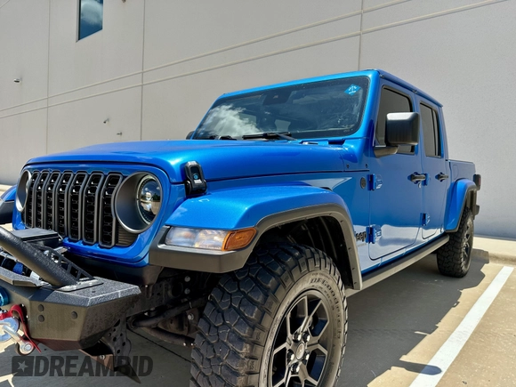 2024 Jeep Gladiator Sport S with VIN 1C6HJTAG0RL123040, listed as a IAAI auction lot 42628429 with 15,046 mi miles and . Bid and sale history available at DreamBid. Image 2.