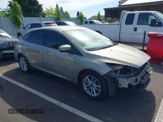 2015 Ford Focus SE z VIN 1FADP3F29FL206003, wystawiony jako IAAI lot #42187898 z przebiegiem 149 560 mil mil oraz . Historia ofert i sprzedaży dostępna na DreamBid. Obrazek 1.