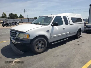 2003 Ford F-150 XL with VIN 2FTRX17L23CA17128, listed as a Copart auction lot 60144965 with 121,055 mi miles and Salvage title. Bid and sale history available at DreamBid. Image 1.