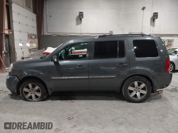 2012 Honda Pilot Touring with VIN 5FNYF4H99CB052034, listed as a IAAI auction lot 42023430 with 137,428 mi miles. Bid and sale history available at carsss.com. Image 14.