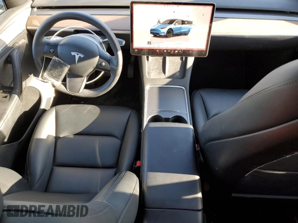 2023 Tesla Model Y Long Range with VIN 7SAYGDEEXPA078937, listed as a Copart auction lot 47095285 with 28,521 mi miles and Salvage Title. Bid and sale history available at DreamBid. Image 8.