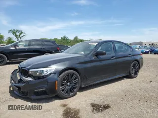 2018 BMW 5 Series 540i xDrive with VIN WBAJE7C50JWC56112, listed as a Copart auction lot 56698825 with 105,386 mi miles and Salvage title. Bid and sale history available at DreamBid. Image 1.