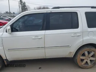 2013 Honda Pilot Touring with VIN 5FNYF3H98DB025516, listed as a IAAI auction lot 41767097 with 202,908 mi miles and . Bid and sale history available at DreamBid. Image 14.