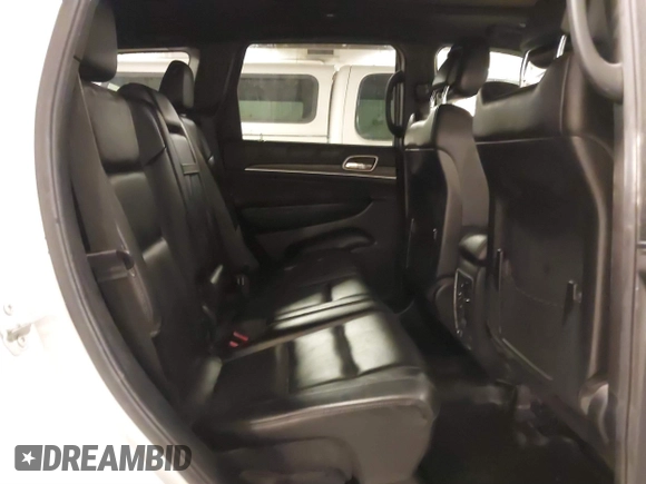 2021 Jeep Grand Cherokee 80th Anniversary with VIN 1C4RJFBG6MC569585, listed as a IAAI auction lot 41341608 with 73,234 mi miles and . Bid and sale history available at DreamBid. Image 8.