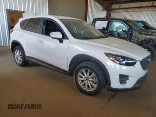 2016 Mazda CX-5 Touring with VIN JM3KE2CY7G0900533, listed as a Copart auction lot 47644565 with 132,689 mi miles and Salvage Title. Bid and sale history available at carsss.com. Image 4.