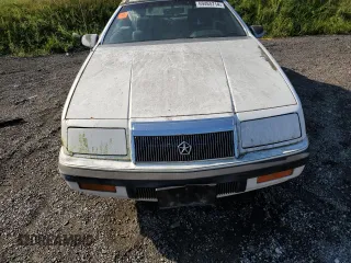 1992 Chrysler LeBaron z VIN 1C3XU553XNF239048, wystawiony jako Copart lot #69465714 z przebiegiem Nie podano mil oraz Tytuł czysty. Historia ofert i sprzedaży dostępna na DreamBid. Obrazek 11.