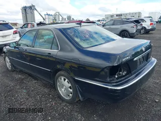2004 Acura RL w/Navigation System with VIN JH4KA96624C003779, listed as a IAAI auction lot 39542033 with 80,018 mi miles. Bid and sale history available at carsss.com. Image 3.