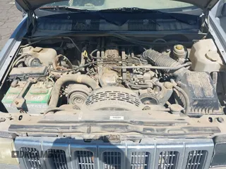 1997 Jeep Grand Cherokee Laredo z VIN 1J4GZ58S4VC720943, wystawiony jako IAAI lot #42648807 z przebiegiem 231 203 mil mil oraz . Historia ofert i sprzedaży dostępna na DreamBid. Obrazek 10.