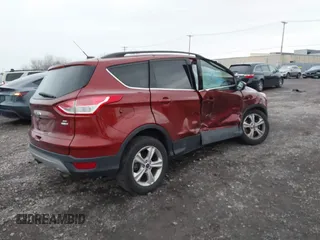 2016 Ford Escape SE with VIN 1FMCU9GX8GUB28820, listed as a IAAI auction lot 40874359 with 134,459 mi miles. Bid and sale history available at carsss.com. Image 4.