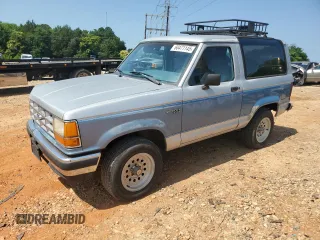 1990 Ford Bronco with VIN 1FMCU14T0LUB35497, listed as a Copart auction lot 60471145 with 403 mi miles and Salvage title. Bid and sale history available at DreamBid. Image 1.
