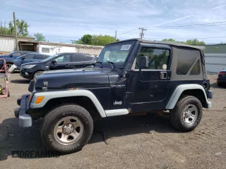 2002 Jeep Wrangler X z VIN 1J4FA39S12P759967, wystawiony jako Copart lot #57851495 z przebiegiem 178 035 mil mil oraz Szkoda całkowita • Salvage title. Historia ofert i sprzedaży dostępna na DreamBid. Obrazek 1.