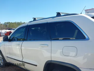 2012 Jeep Grand Cherokee Laredo with VIN 1C4RJEAG5CC106203, listed as a IAAI auction lot 41821138 with 157,474 mi miles. Bid and sale history available at carsss.com. Image 14.