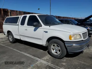 2000 Ford F-150 XL with VIN 1FTZX172XYNC01869, listed as a Copart auction lot 47414095 with 0 mi miles and Salvage Title. Bid and sale history available at carsss.com. Image 4.