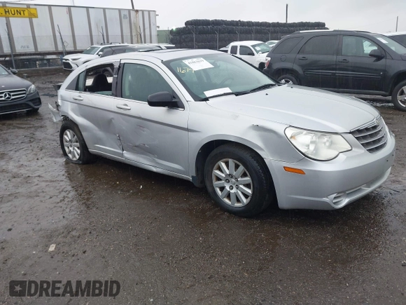 2010 Chrysler Sebring Touring z VIN 1C3CC4FB5AN128652, wystawiony jako IAAI lot #41863619 z przebiegiem 123 698 mil mil oraz . Historia ofert i sprzedaży dostępna na DreamBid. Obrazek 1.