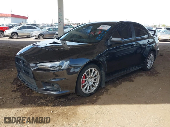 2013 Mitsubishi Lancer Evolution GSR with VIN JA32W8FV6DU009257, listed as a IAAI auction lot 41917942 with 125,279 mi miles. Bid and sale history available at carsss.com. Image 2.
