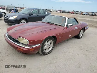 1995 Jaguar XJS with VIN SAJNX2742SC197388, listed as a Copart auction lot 76579714 with 99,077 mi miles and Salvage Title. Bid and sale history available at carsss.com. Image 1.