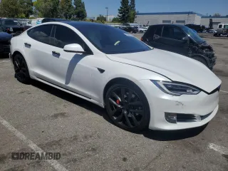 2020 Tesla Model S Performance with VIN 5YJSA1E42LF401157, listed as a Copart auction lot 55082875 with 60,376 mi miles and Salvage title. Bid and sale history available at DreamBid. Image 4.