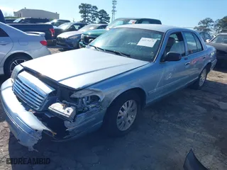 2005 Ford Crown Victoria LX with VIN 2FAFP74W65X135964, listed as a IAAI auction lot 41271175 with 82,494 mi miles. Bid and sale history available at carsss.com. Image 17.
