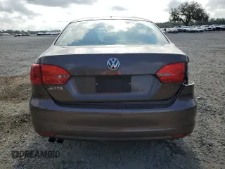 2014 Volkswagen Jetta S with VIN 3VW2K7AJXEM209993, listed as a Copart auction lot 54920565 with 130,466 mi miles and Clean title. Bid and sale history available at DreamBid. Image 6.