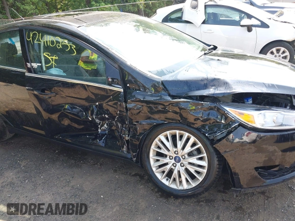 2018 Ford Focus Titanium with VIN 1FADP3J22JL220986, listed as a IAAI auction lot 42410253 with 40,791 mi miles and . Bid and sale history available at DreamBid. Image 6.