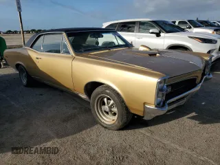 1967 Pontiac GTO z VIN 242177P108834, wystawiony jako Copart lot #74698414 z przebiegiem 230 374 mil mil oraz Szkoda całkowita • Salvage title. Historia ofert i sprzedaży dostępna na DreamBid. Obrazek 4.