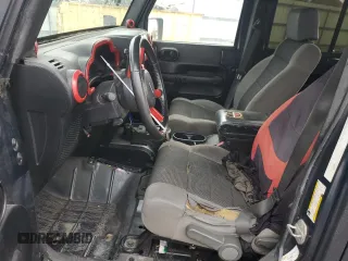 2007 Jeep Wrangler Unlimited X with VIN 1J4GA391X7L171902, listed as a Copart auction lot 82150334 with 167,695 mi miles and Salvage title. Bid and sale history available at DreamBid. Image 7.