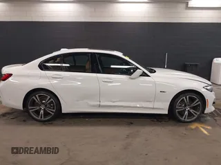 2023 BMW 3 Series 330e xDrive with VIN 3MW39FS05P8D20575, listed as a IAAI auction lot 42076033 with 10,875 mi miles. Bid and sale history available at carsss.com. Image 13.