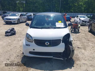 2016 Smart fortwo Passion z VIN WMEFJ5DA6GK078340, wystawiony jako IAAI lot #42140363 z przebiegiem 114 647 mil mil oraz . Historia ofert i sprzedaży dostępna na DreamBid. Obrazek 13.